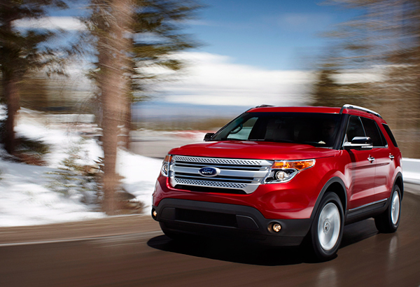 Red 2012 Ford Explorer on road