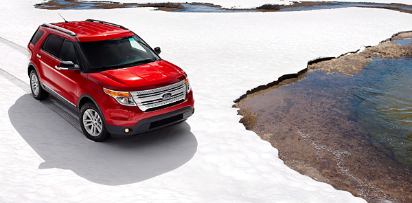 Red 2012 Ford Explorer on snow